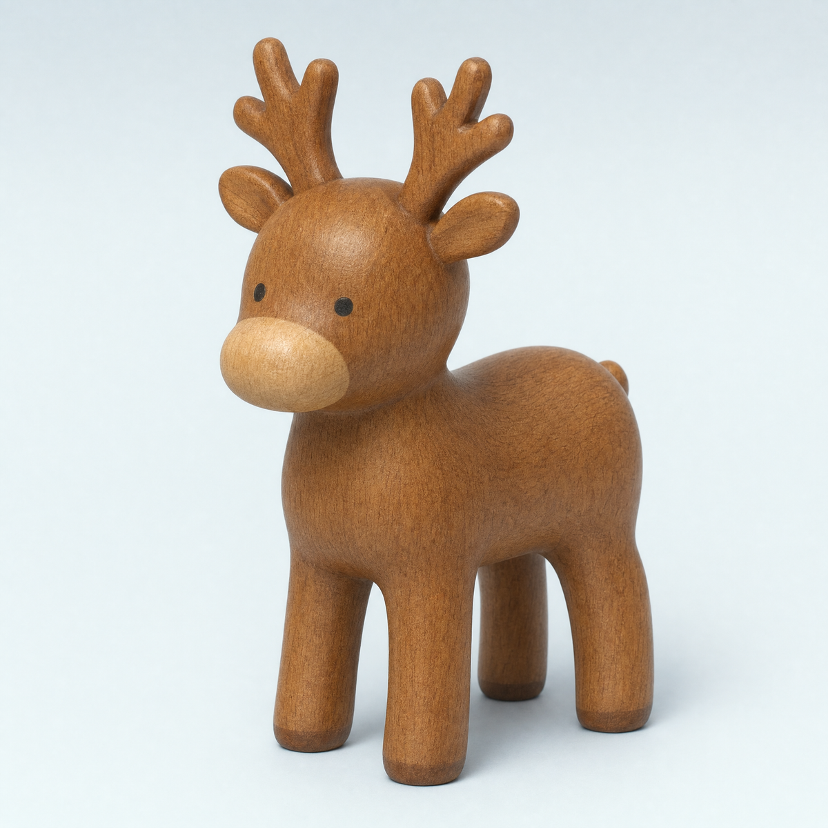 Jorlaxis Reindeer: a mid-brown wooden reindeer with a pale muzzle and small carved antlers