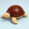 Jorlaxis Sea Turtle: a wooden turtle with a dark mahogany shell over a pale body