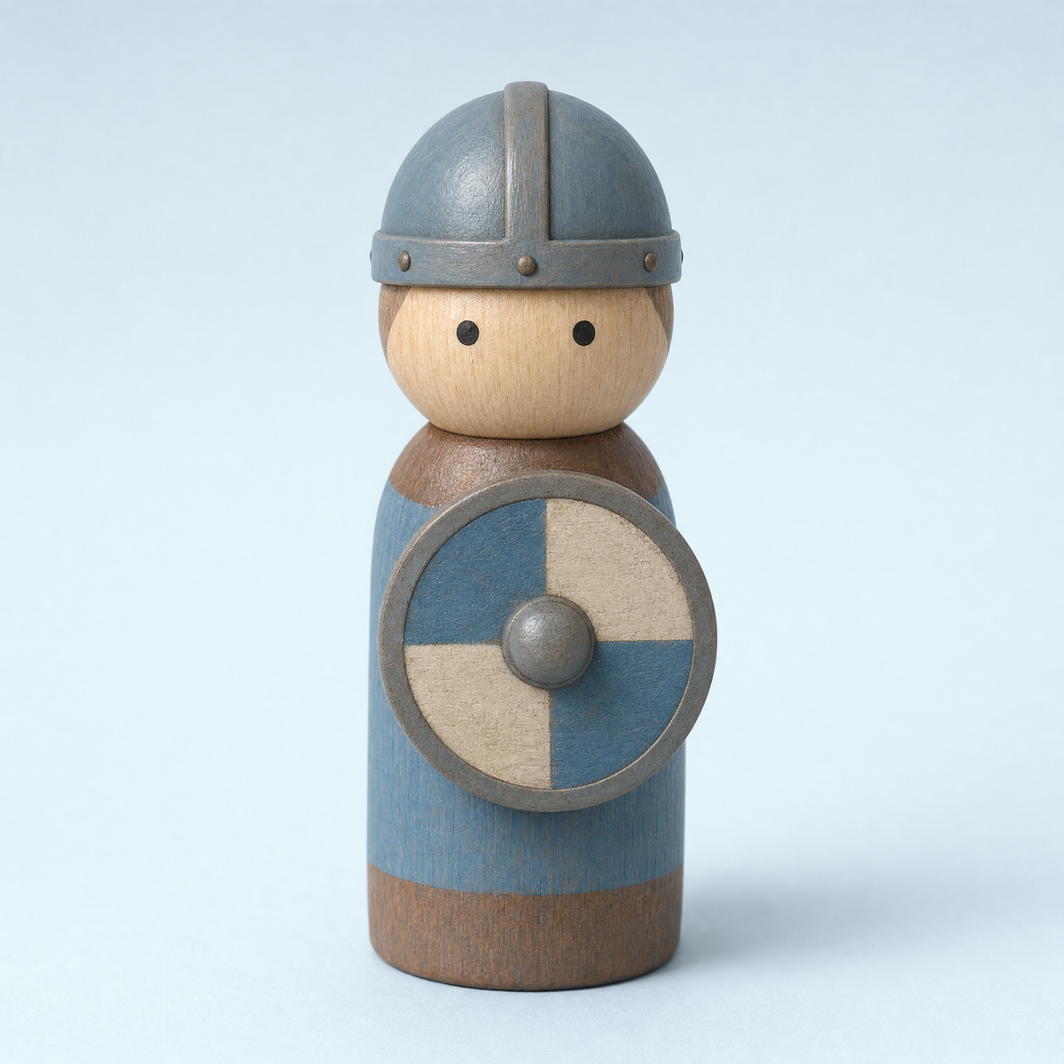 Jorlaxis Shieldbearer: a wooden peg figure in a plain rounded helmet with a painted round shield